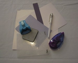 White and light blue shimmer paper, heavy navy paper, white pen, corner rounder, tape roller, Snowflake die and snowflakes embossing folder (and glue dots)